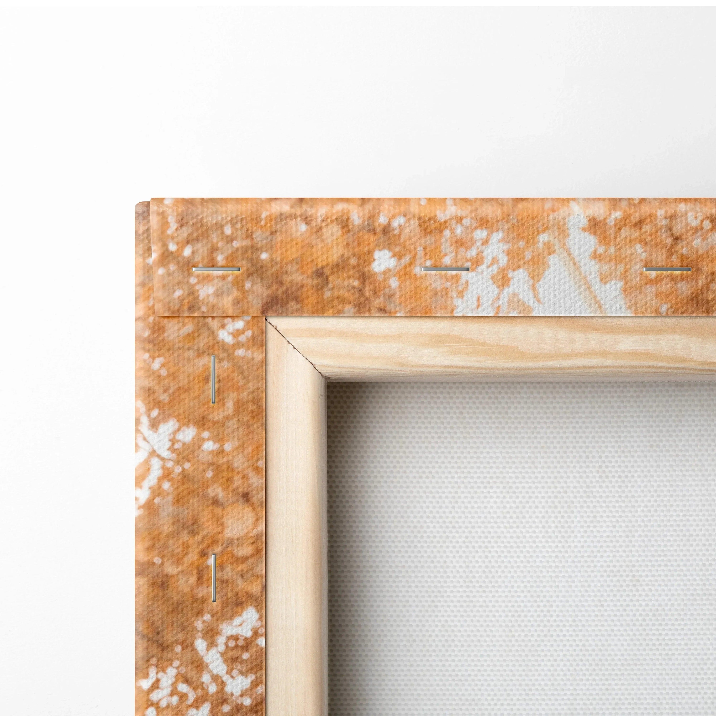 Close-up of stretched canvas art with wooden stretcher bars and textured edge for wall art display.