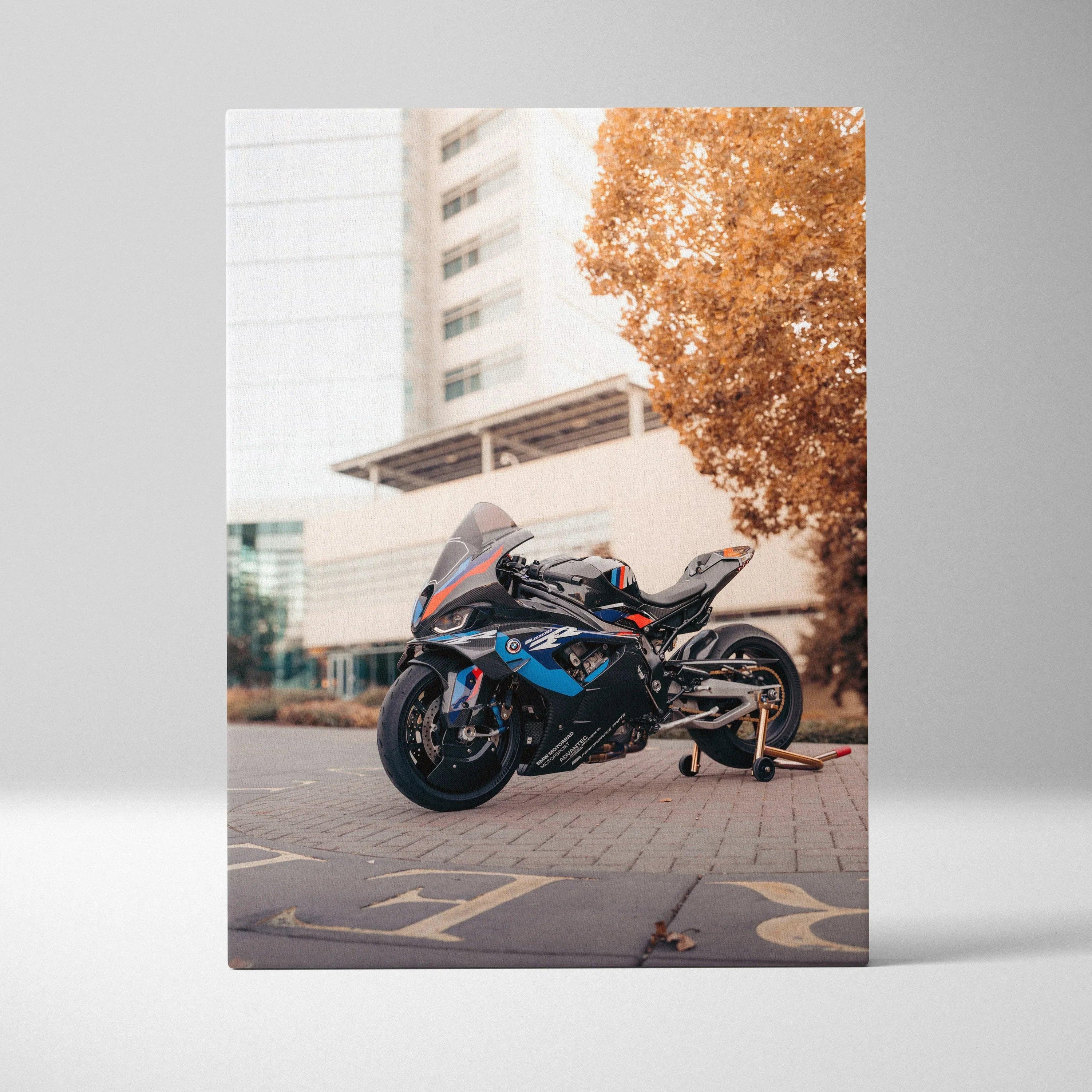 BMW M1000RR motorcycle wall art canvas with urban background and autumn tree.