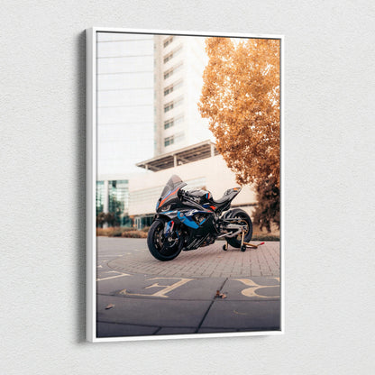 BMW M1000RR motorcycle canvas wall art with urban background and warm fall tones.