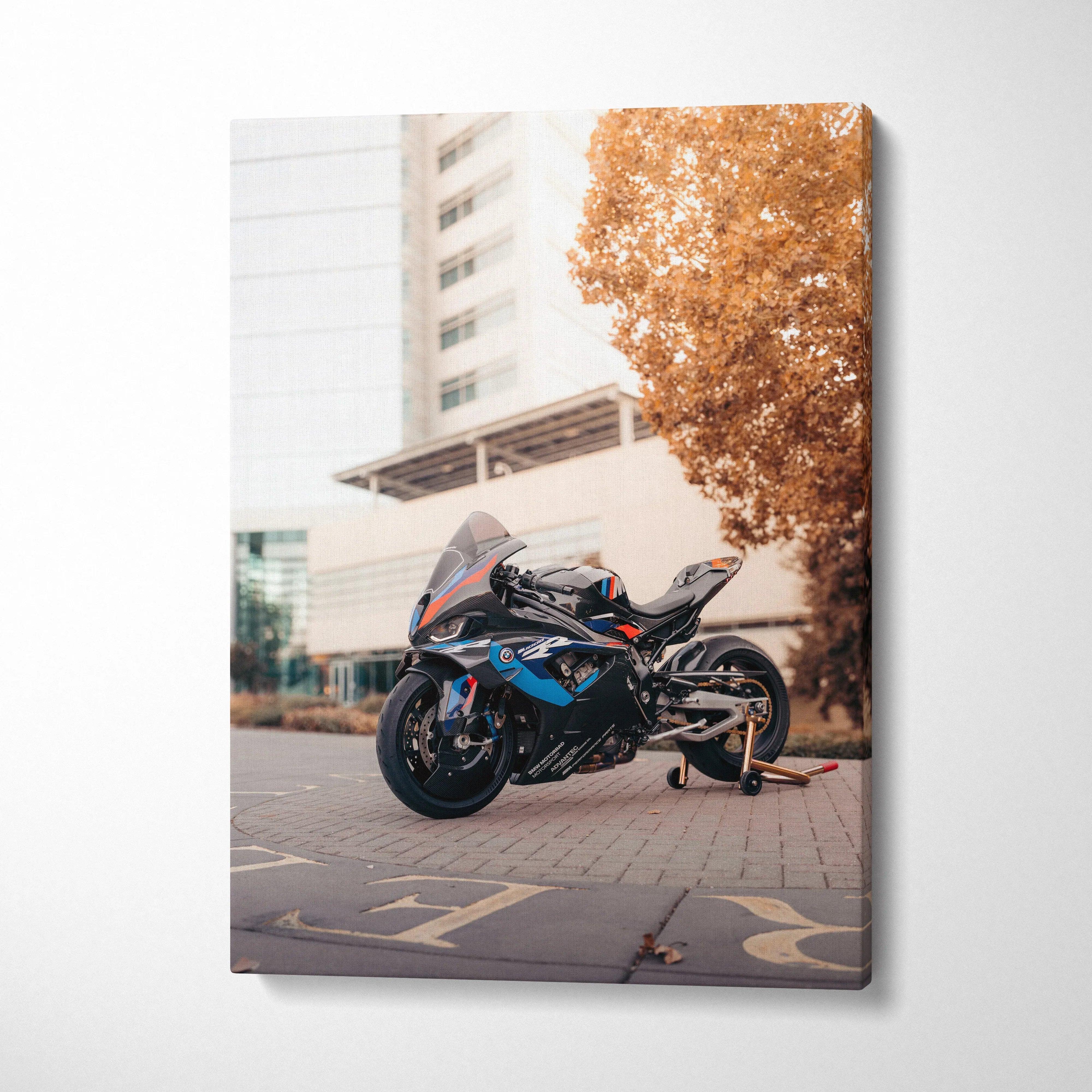 Vertical canvas wall art featuring a BMW M1000RR motorcycle with urban background and autumn tree.