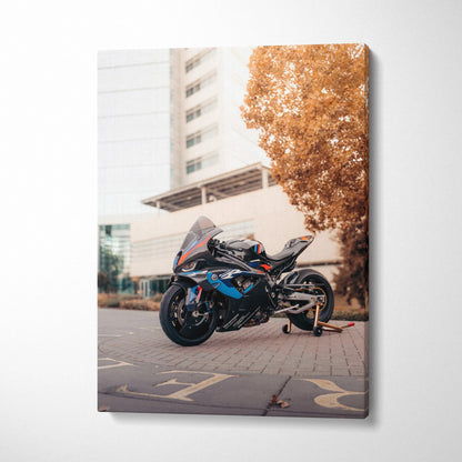 Vertical canvas wall art featuring a BMW M1000RR motorcycle with urban background and autumn tree.