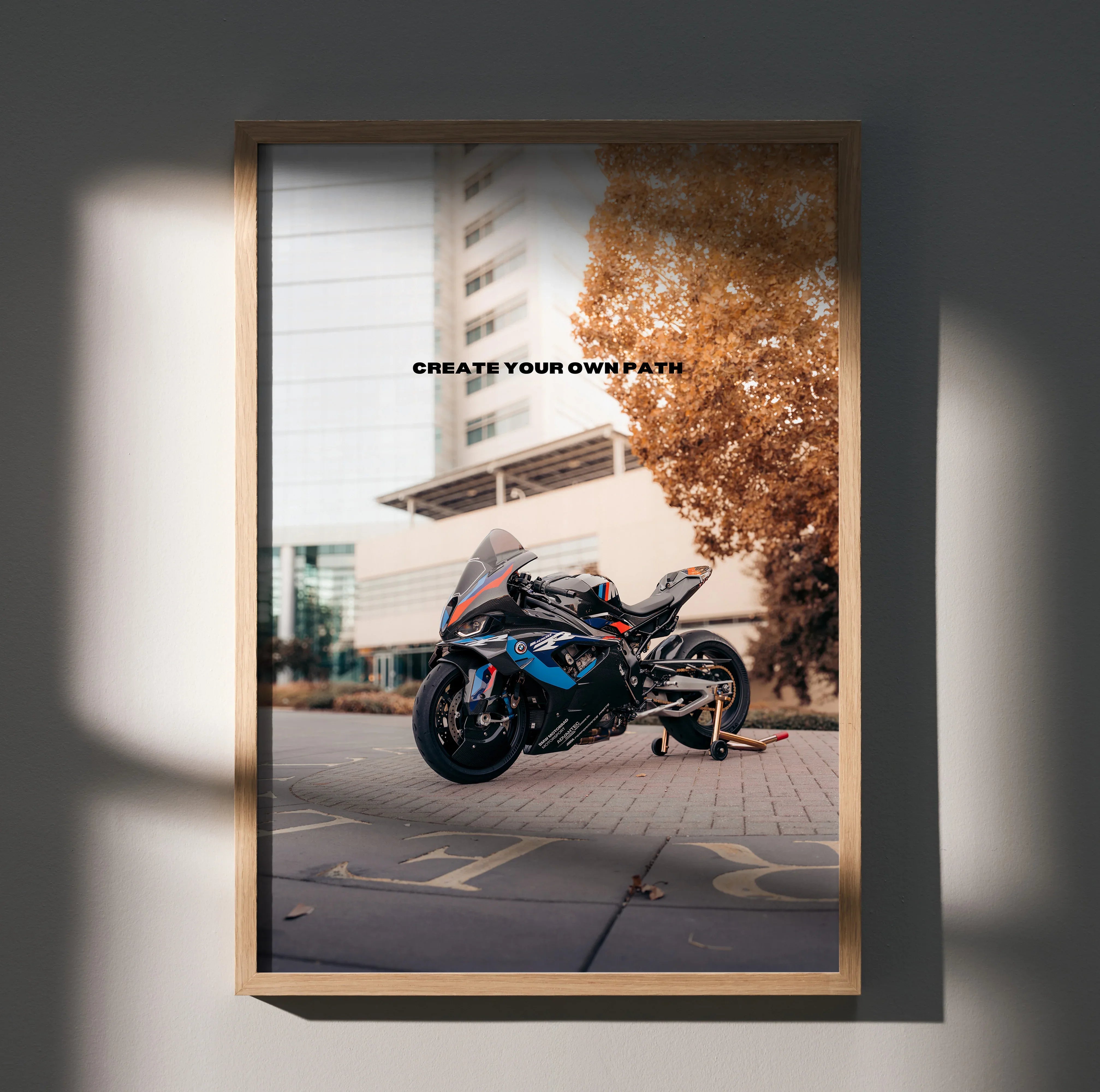 BMW M1000RR motorcycle motivational poster with "Create Your Own Path" text, wall art in wooden frame.