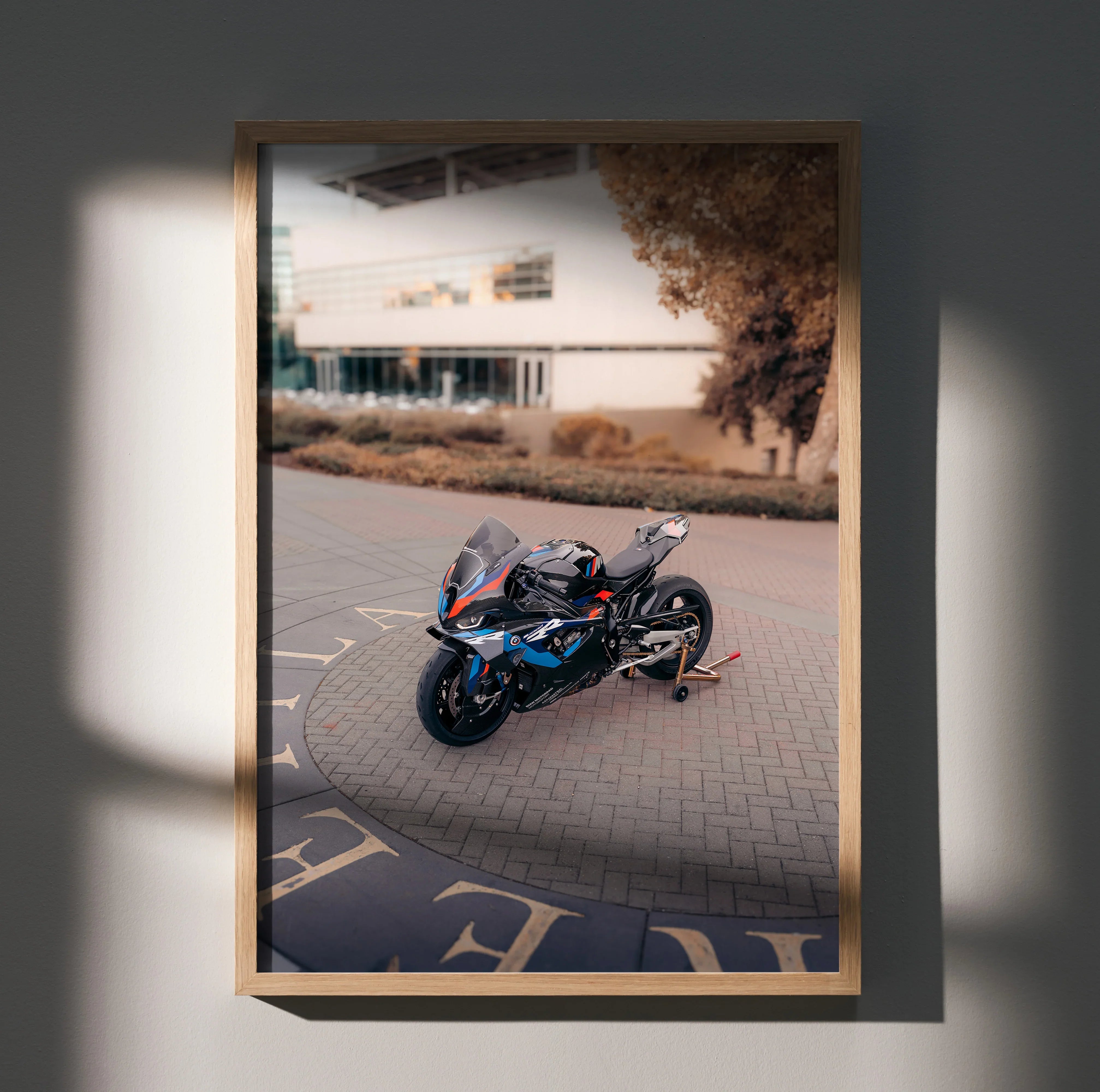 BMW M1000RR motorcycle wall art poster with sleek black and blue sportbike design in modern frame.