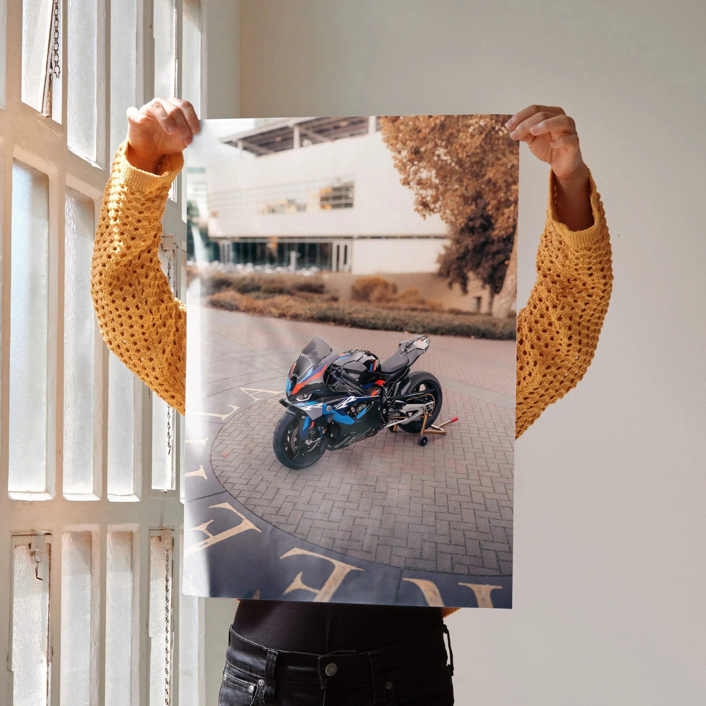 BMW M1000RR motorcycle art print poster showcasing a sleek black and blue sportbike on urban pavement wall art.