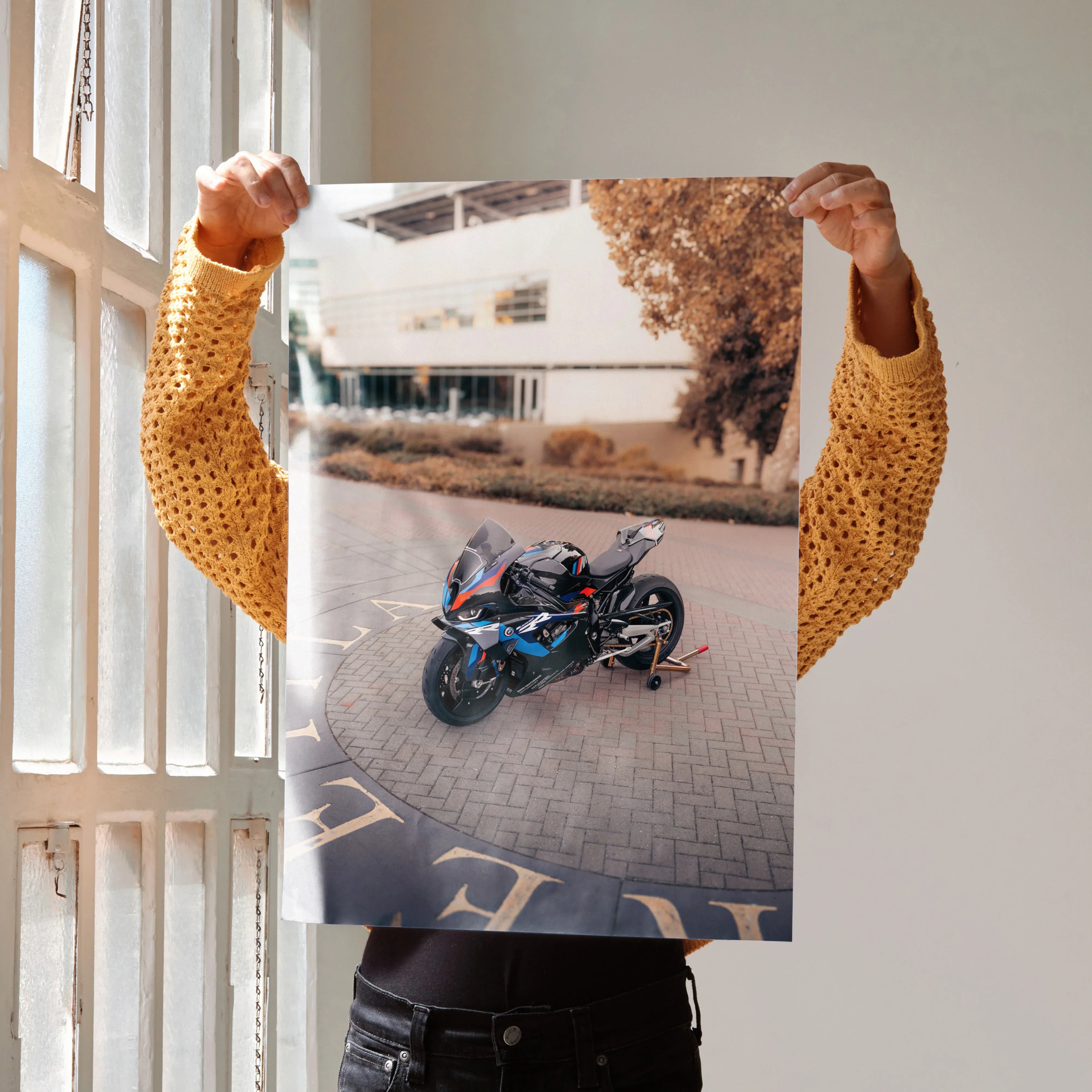 BMW M1000RR motorcycle art print poster showcasing a sleek black and blue sportbike on urban pavement wall art.