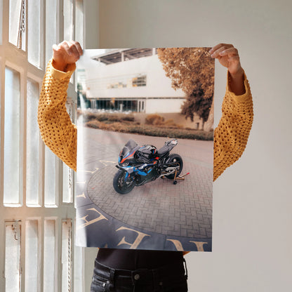 BMW M1000RR motorcycle art print poster showcasing a sleek black and blue sportbike on urban pavement wall art.