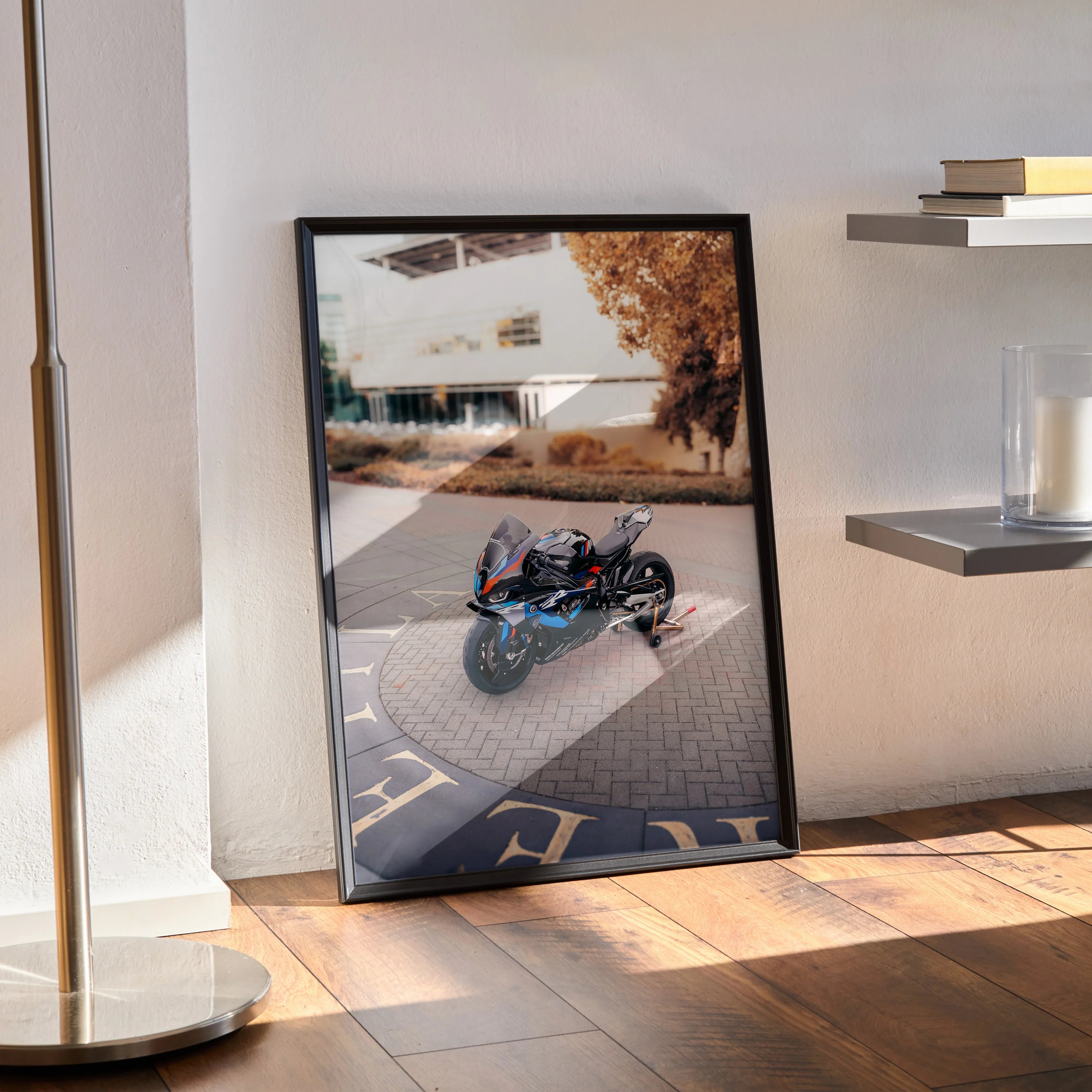 BMW M1000RR motorcycle poster leaning against wall with urban background, premium wall art for bikers.