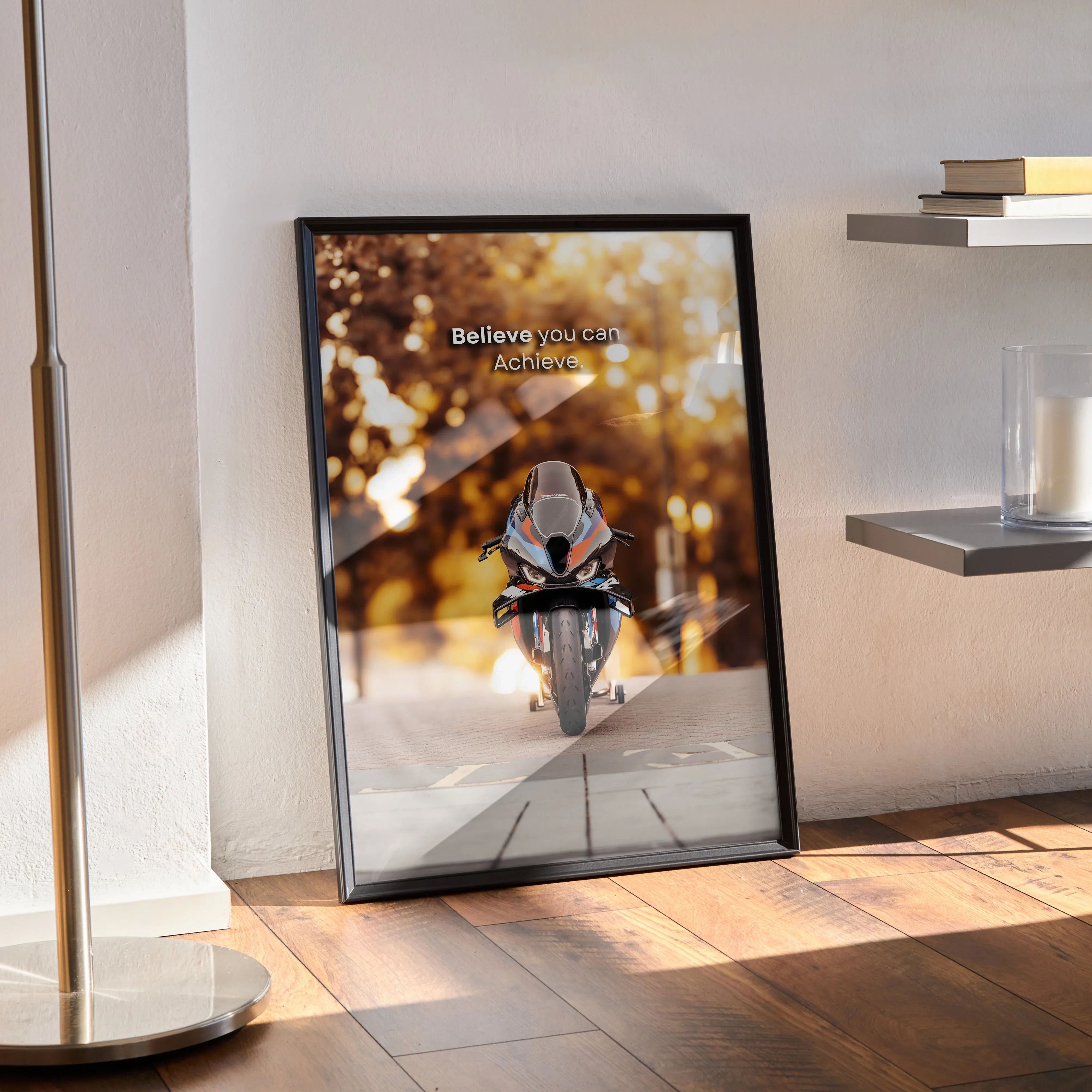 Framed motivational poster with BMW M1000RR motorcycle on road at sunset, inspiring text on wall art.