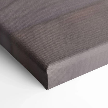 Close-up of a canvas wall art corner with brown textured fabric and wrapped edges.