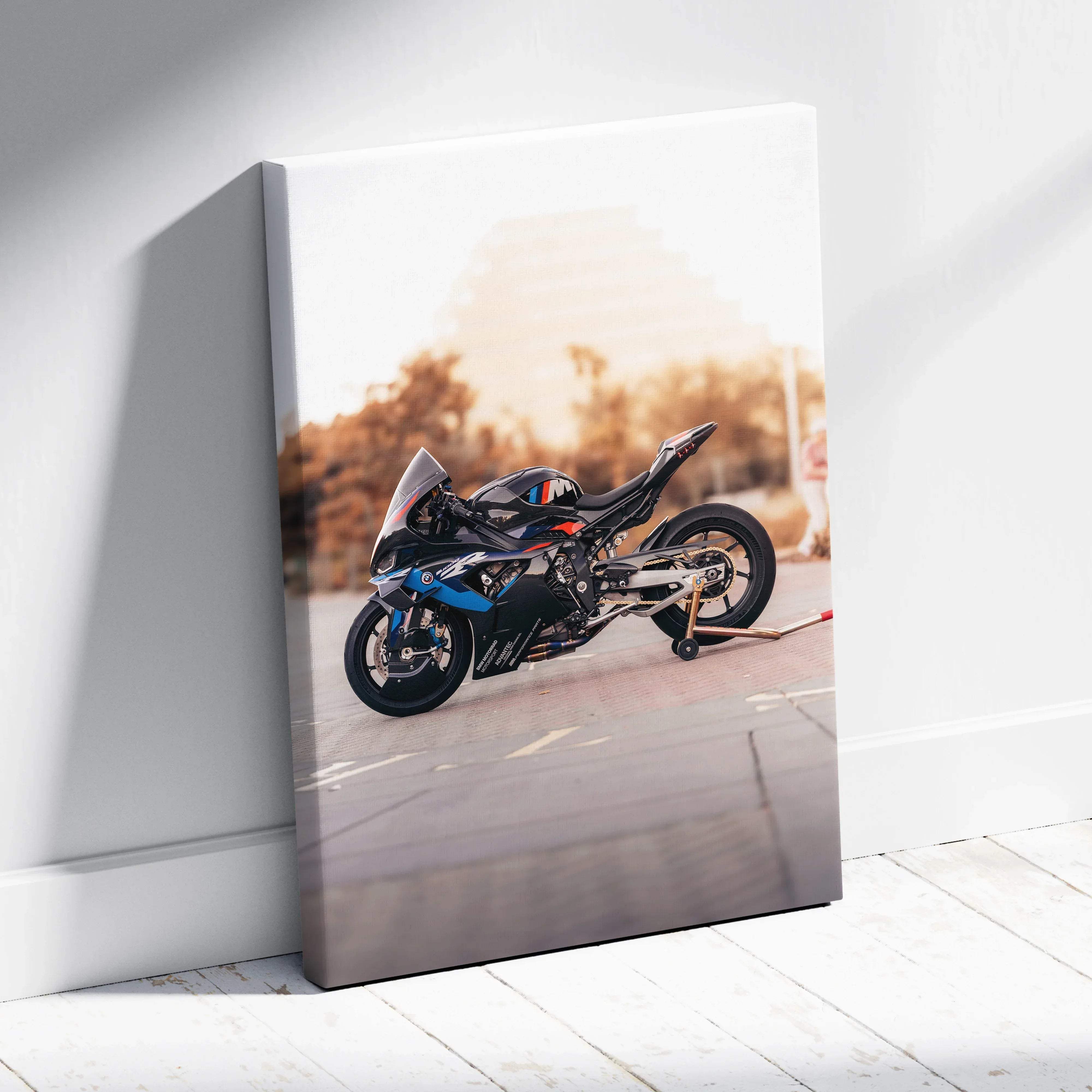 Canvas wall art featuring a black and blue BMW inspired M1000RR sport motorcycle print with red accents and sleek design