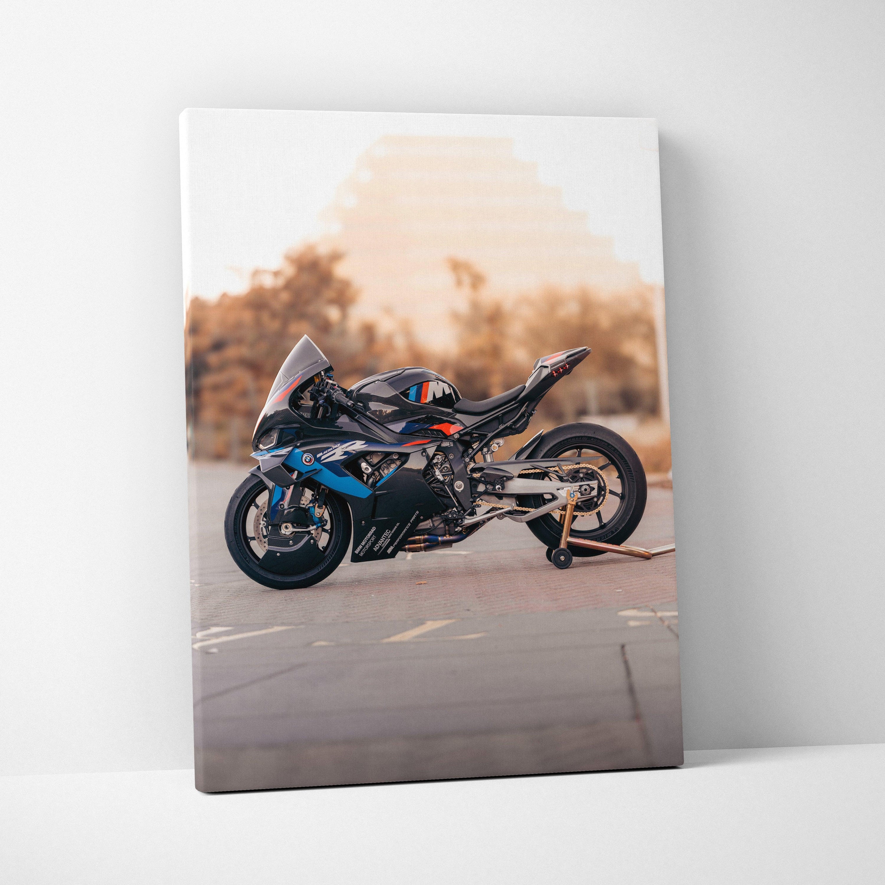 BMW M1000RR motorcycle side view canvas wall art with sunset background.