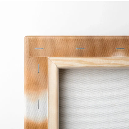 Close-up of wooden stretcher bar and canvas corner with light brown spray paint, showcasing canvas wall art structure.