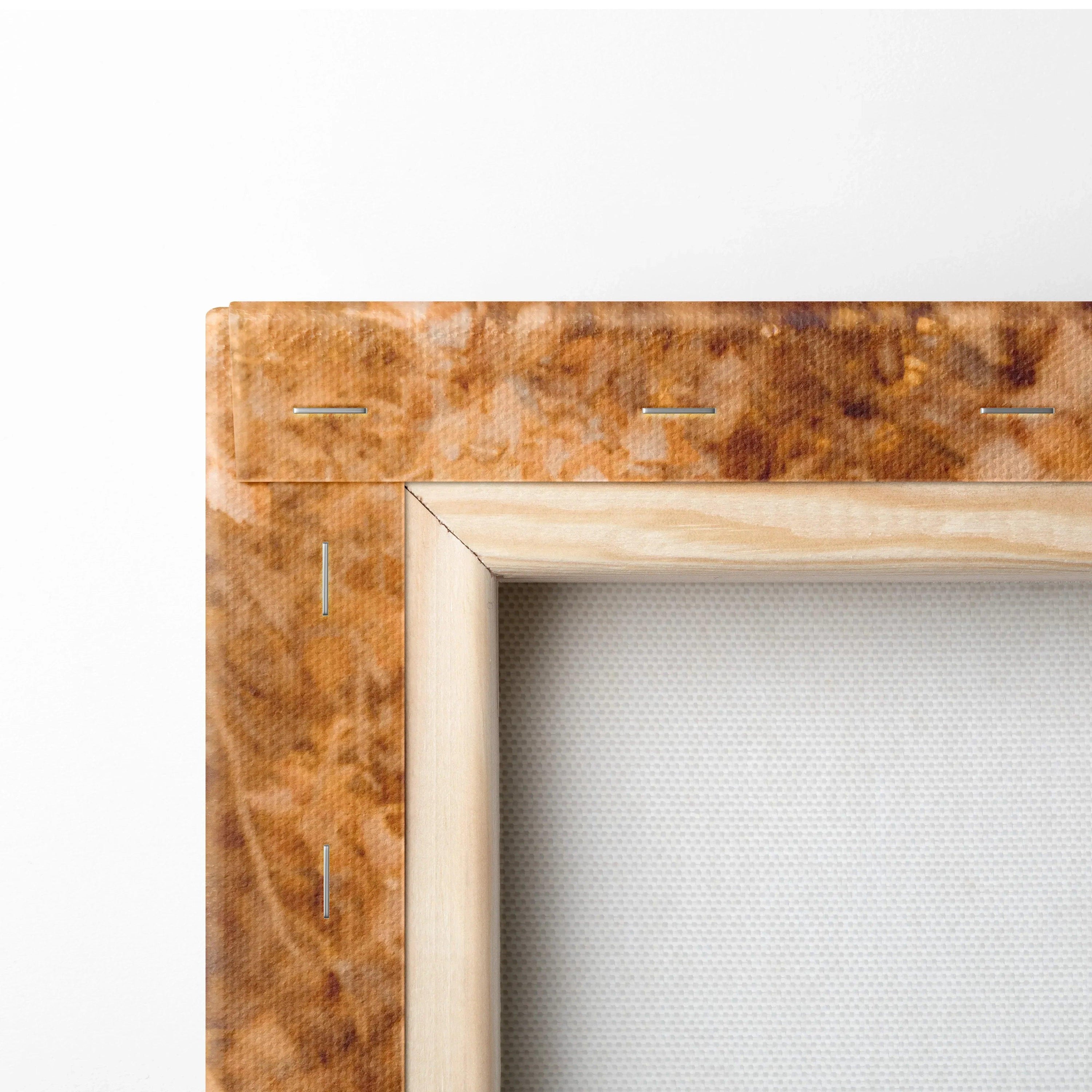 Close-up of wooden frame corner with stretched canvas fabric for wall art display.