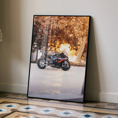 BMW M1000RR motorcycle poster with sunset background, modern wall art in black frame.
