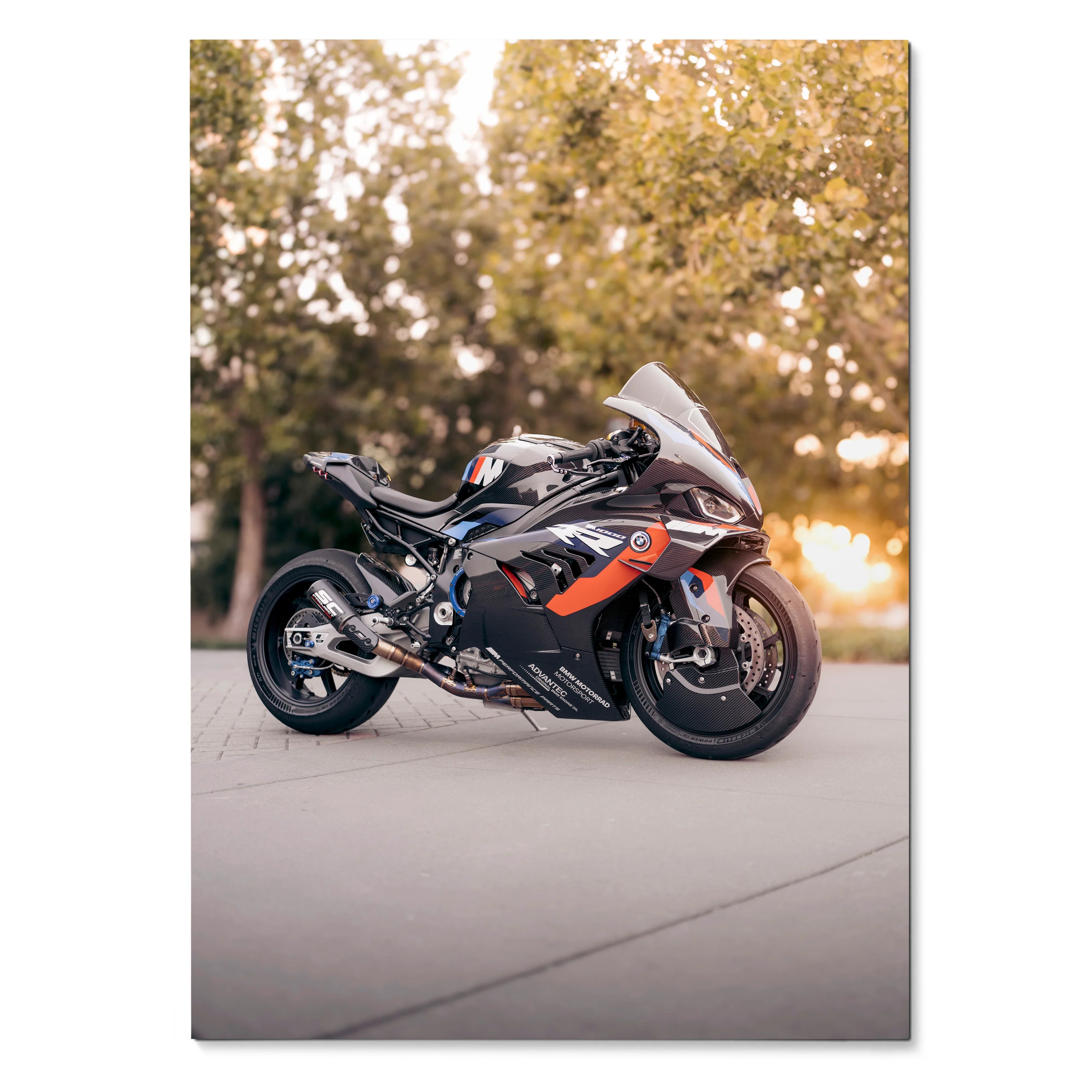 BMW M1000RR motorcycle poster with sleek black and orange design, outdoor setting wall art.