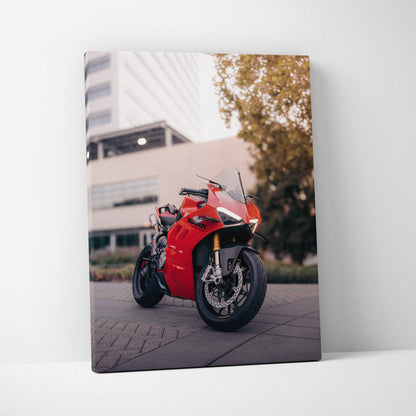 Red Ducati Panigale V4S motorcycle close-up on canvas wall art with urban background.