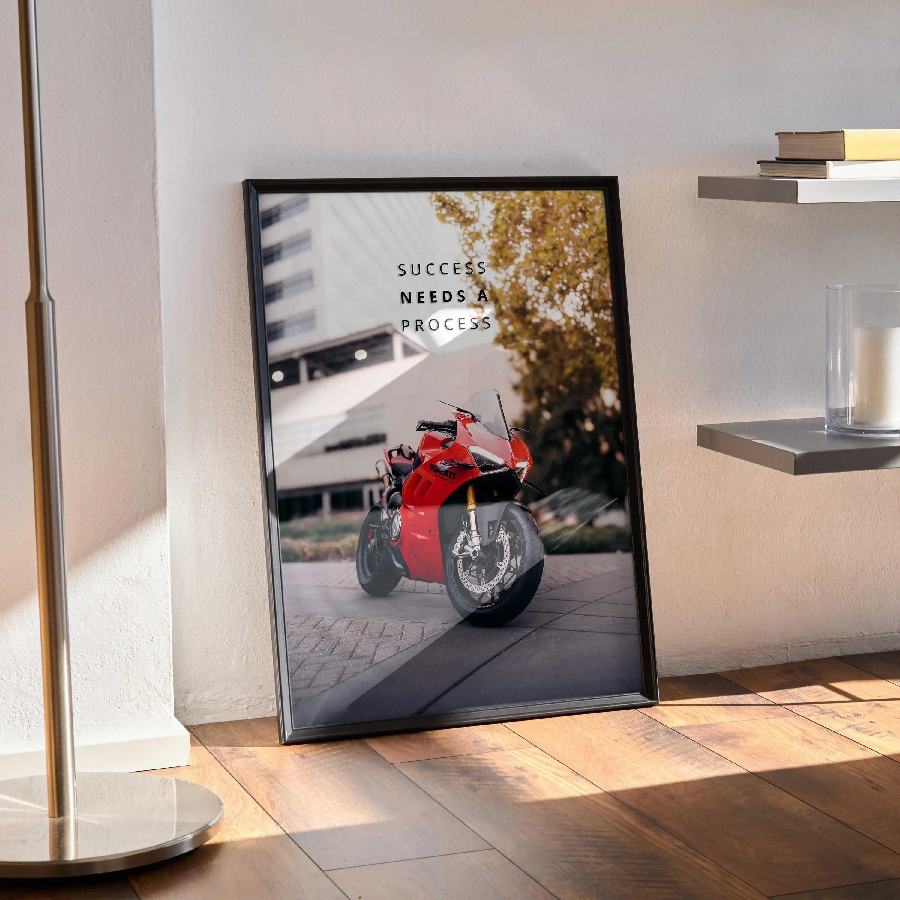 Motivational poster featuring red Ducati Panigale V4S motorcycle with inspiring text, framed wall art.