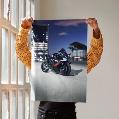 BMW M1000RR motorcycle poster wall art with night cityscape background held by person.
