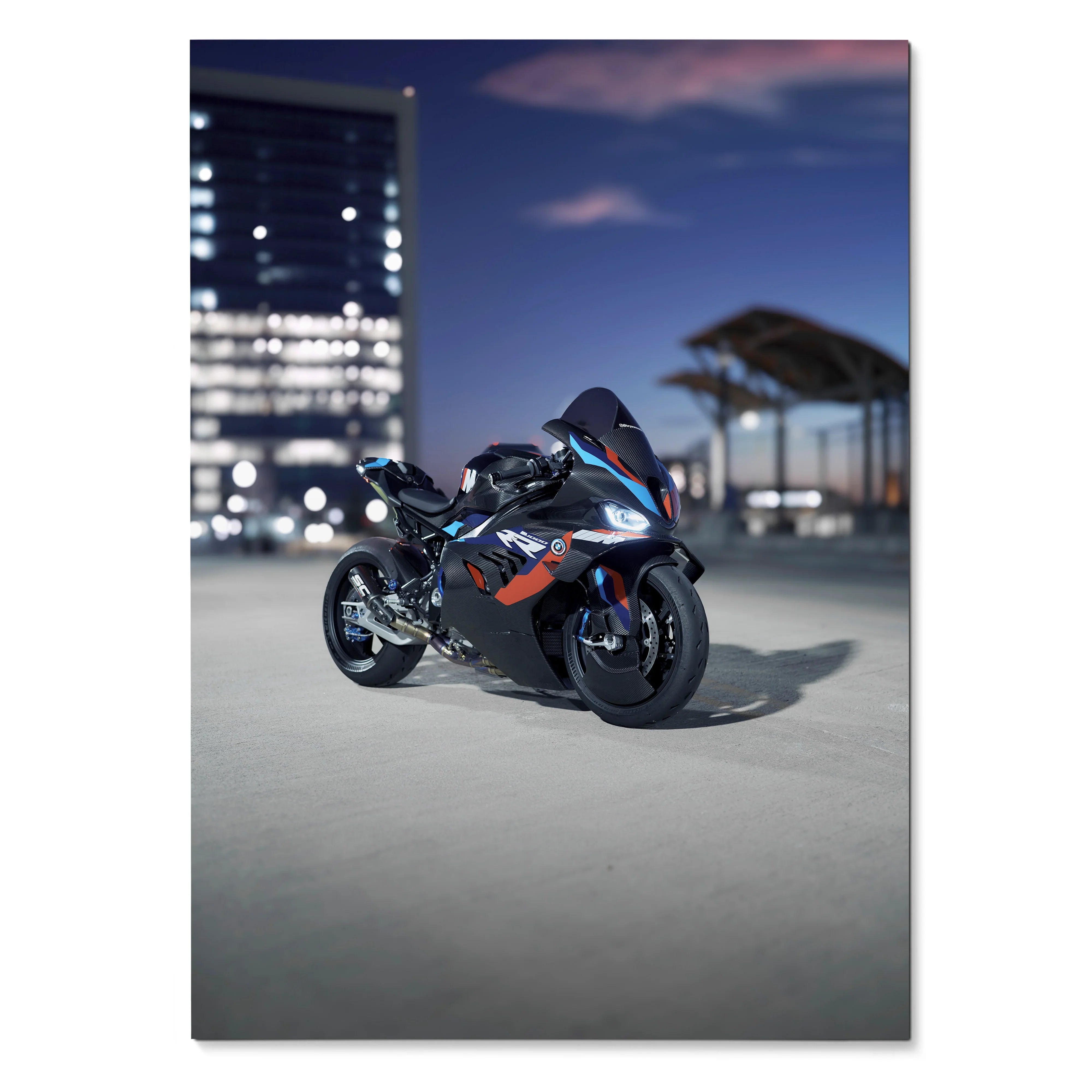 BMW M1000RR motorcycle poster wall art with sleek black and blue bike under evening city lights.