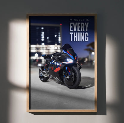 Motivational poster wall art featuring BMW M1000RR motorcycle with inspiring text on dark city background.