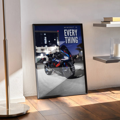 Motivational poster wall art featuring BMW M1000RR motorcycle with inspiring text on dark city background.
