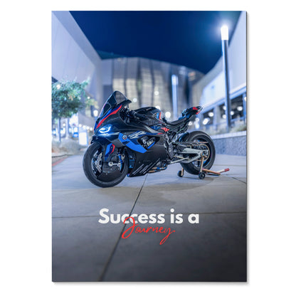 BMW M1000RR motorcycle poster wall art with "Success is a journey" text at night.