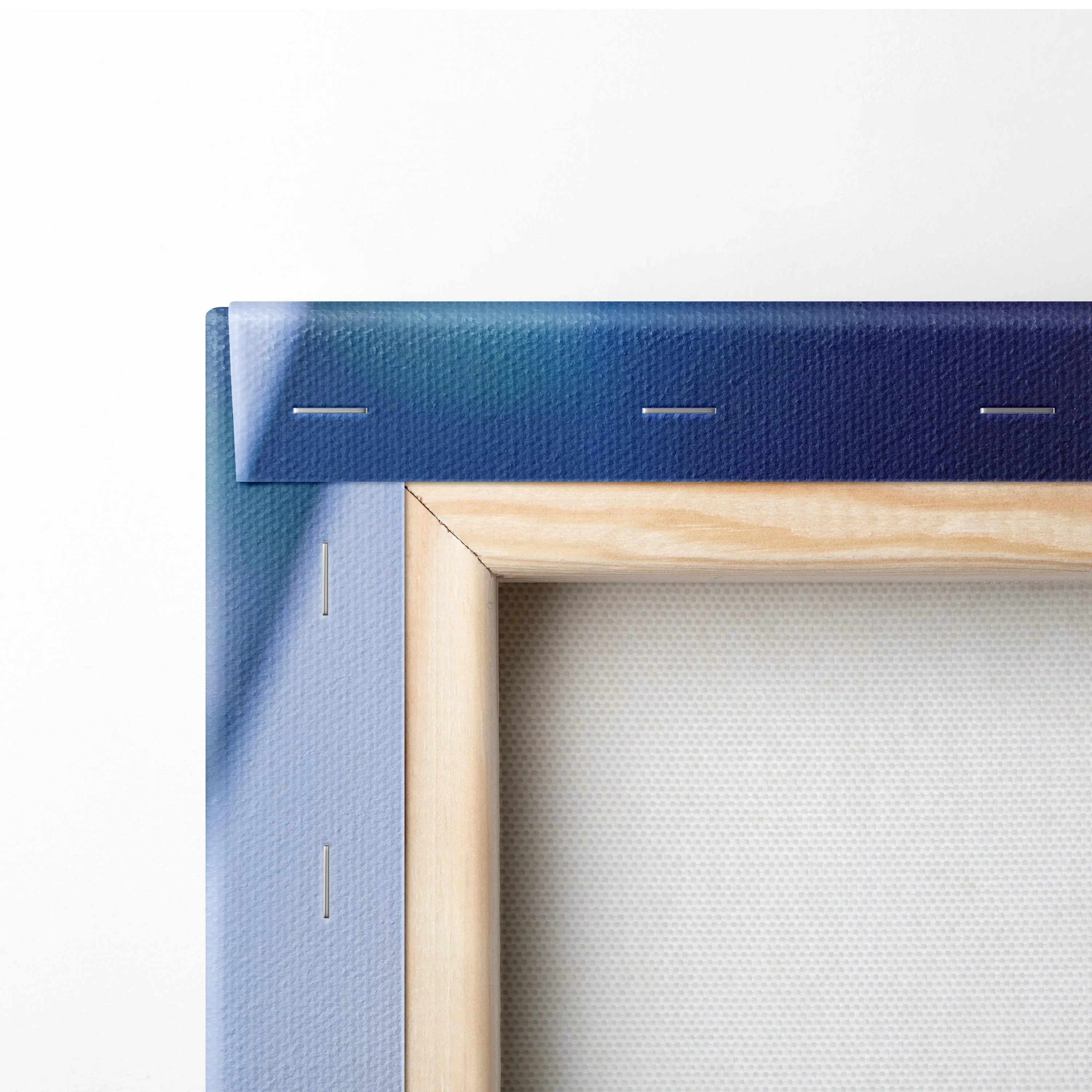 Close-up of blue stretched canvas corner with wooden frame and visible staples, wall art canvas print detail.