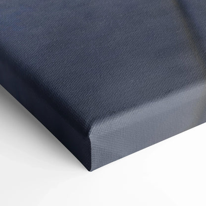 Close-up of dark textured canvas corner showcasing high-quality canvas art with deep stretch on white background.