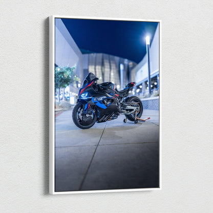 BMW M1000RR motorcycle vertical canvas art with modern urban night backdrop.