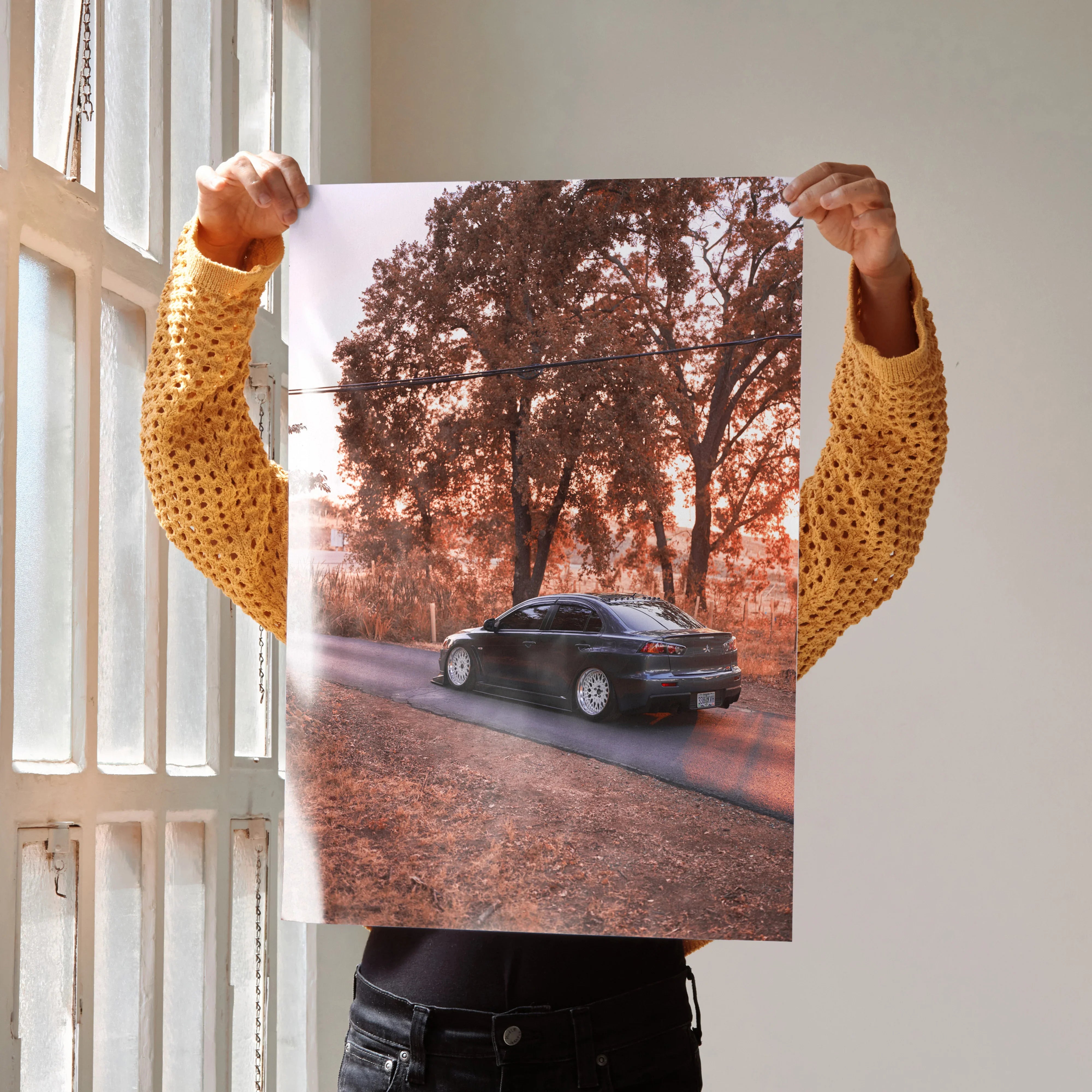 Mitsubishi Evo X poster showing black car on autumn road with orange trees, wall art print.