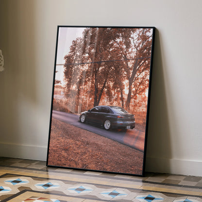 Mitsubishi Evo X poster with autumn trees background leaning against wall, stylish wall art.