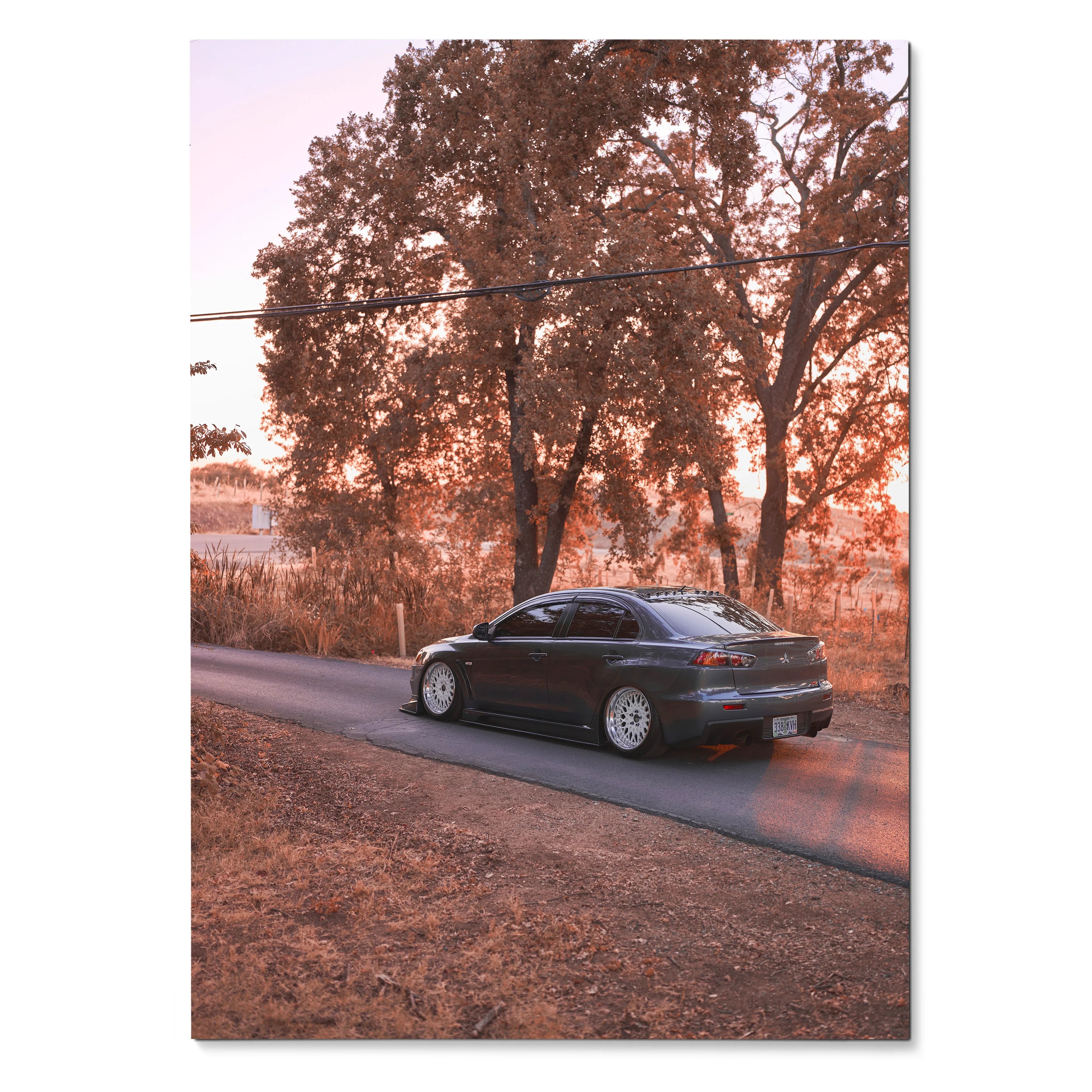 Mitsubishi Evo X parked on rural road with autumn trees background poster wall art.