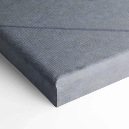 Close-up of wrapped gray canvas art corner with fine texture for wall art display.