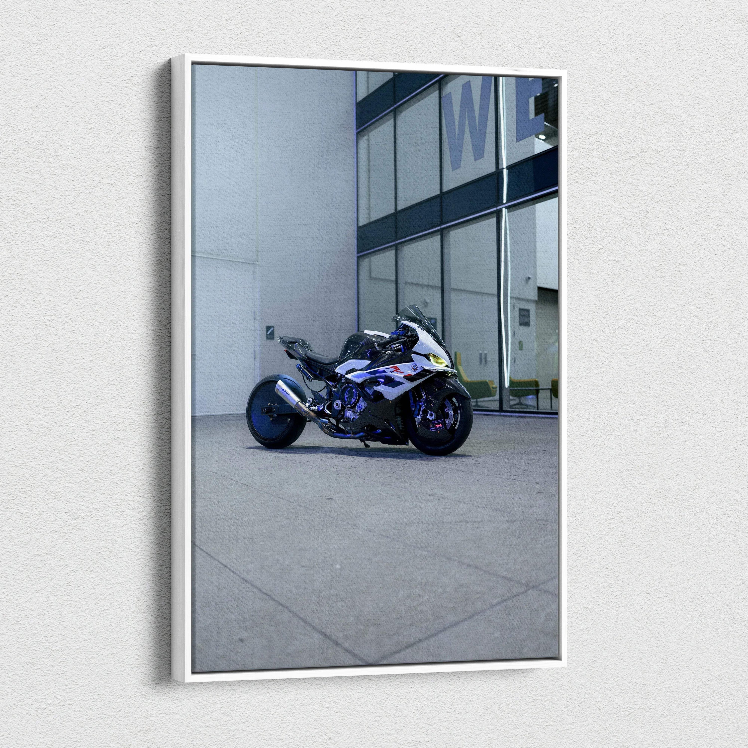 Vertical canvas wall art featuring a BMW S1000RR sportbike parked against a modern building facade.