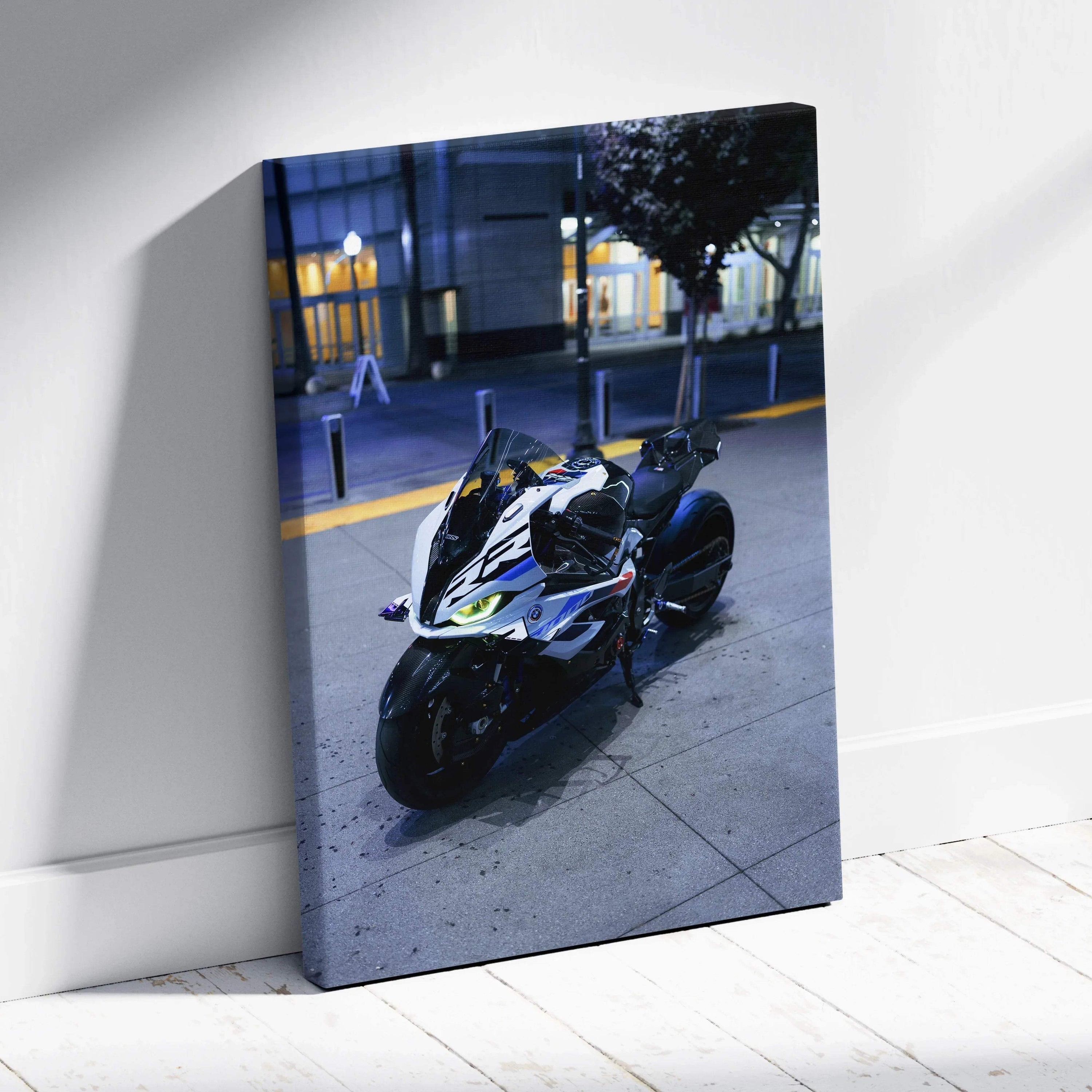 Vertical canvas art featuring a sleek BMW S1000RR motorcycle parked on a city sidewalk at dusk.