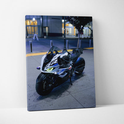 BMW S1000RR motorcycle vertical canvas wall art featuring high-resolution night cityscape detail.
