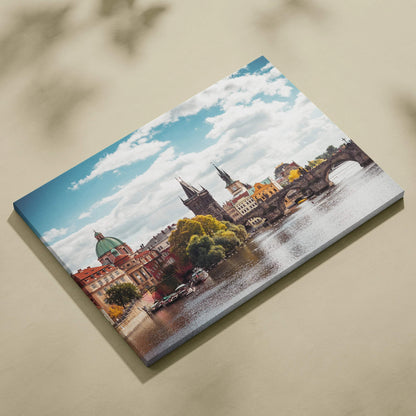 Canvas wall art featuring vibrant digital print of historic buildings and a river under a bright blue sky.