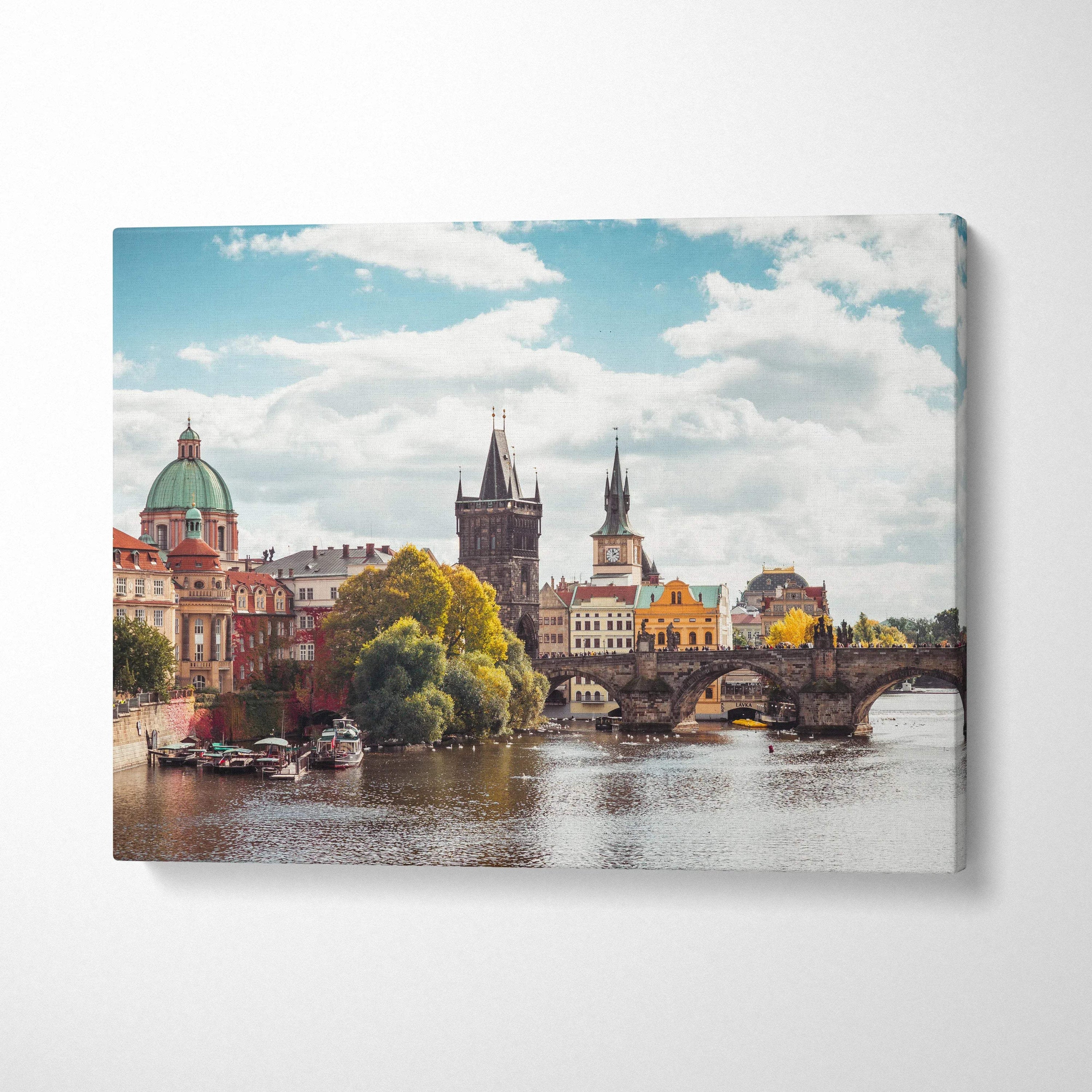 Canvas wall art of historic European architecture with river and blue sky details.