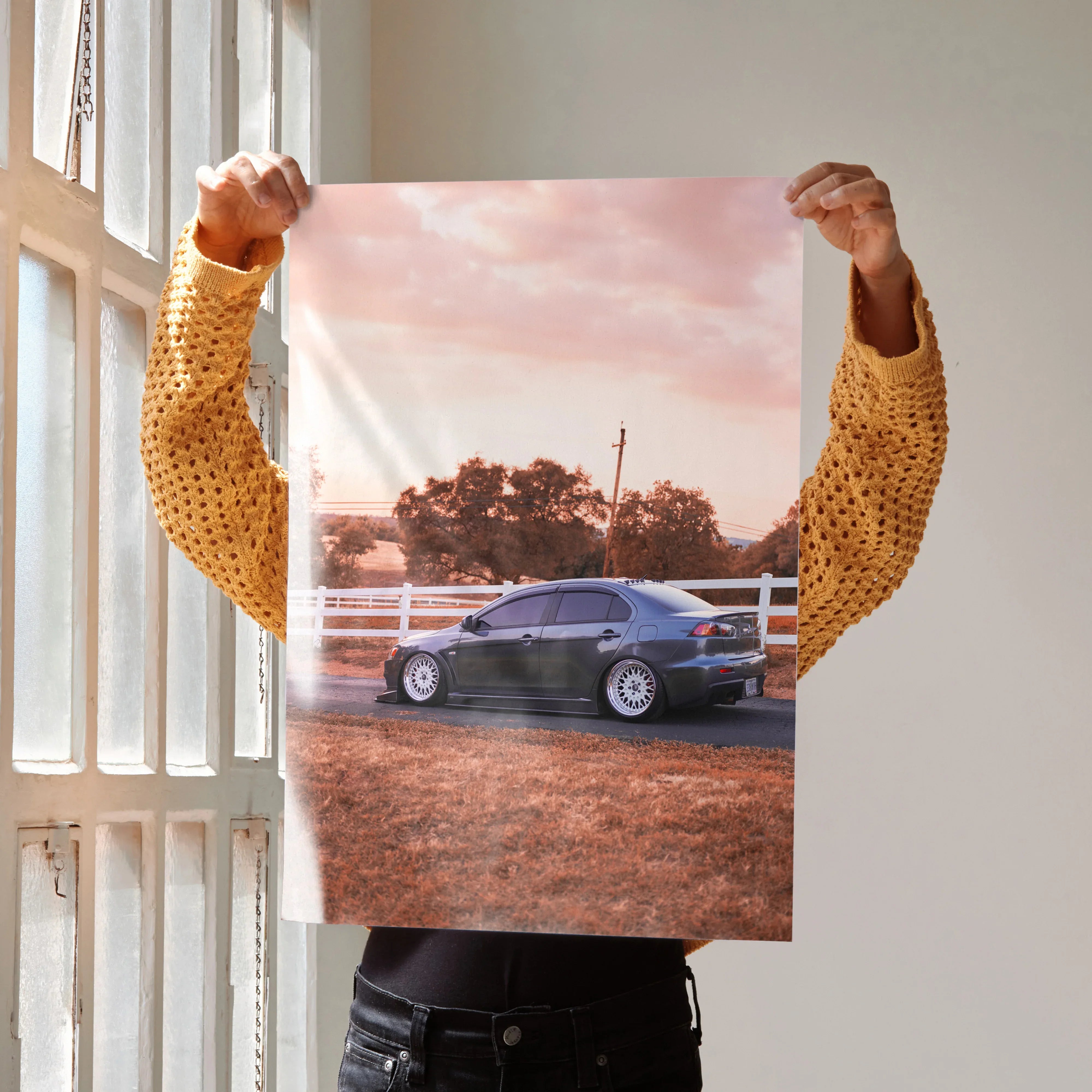 Mitsubishi Evo 10 poster with high-resolution wall art showing car on dirt road at sunset.