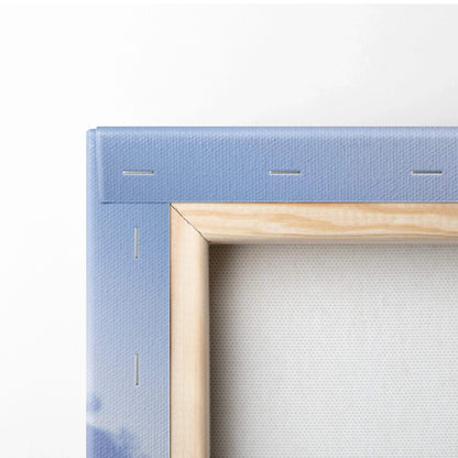 Close-up of wooden stretcher frame with blue canvas corner for vertical wall art print.