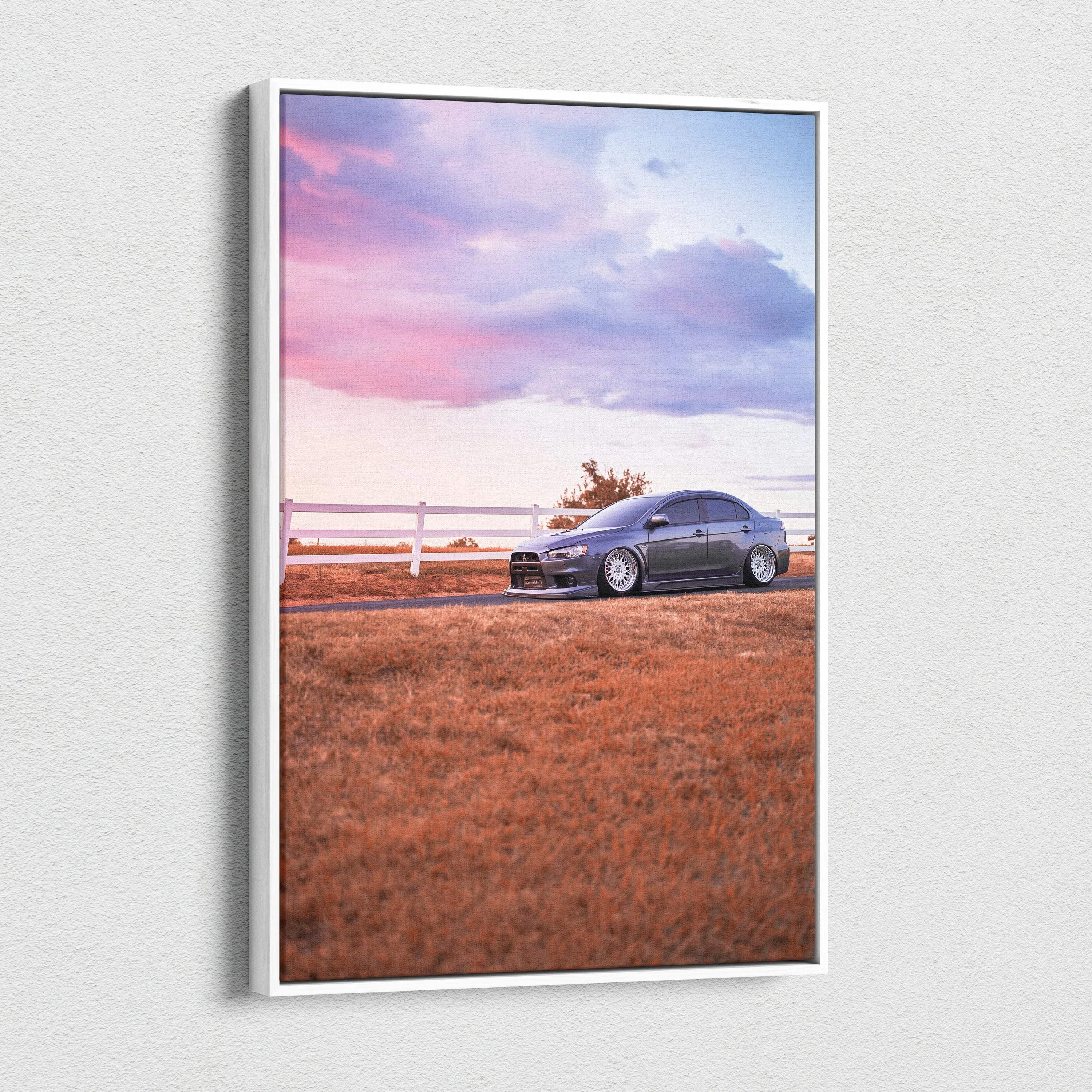 Vertical canvas wall art of Mitsubishi Evo 10 parked on grass at sunset with pink and purple sky.