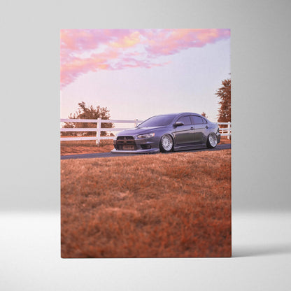 Mitsubishi Evo 10 parked on grass with orange sky background canvas wall art.