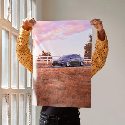 Mitsubishi Evo 10 parked on dirt road under pink and purple sky poster wall art.