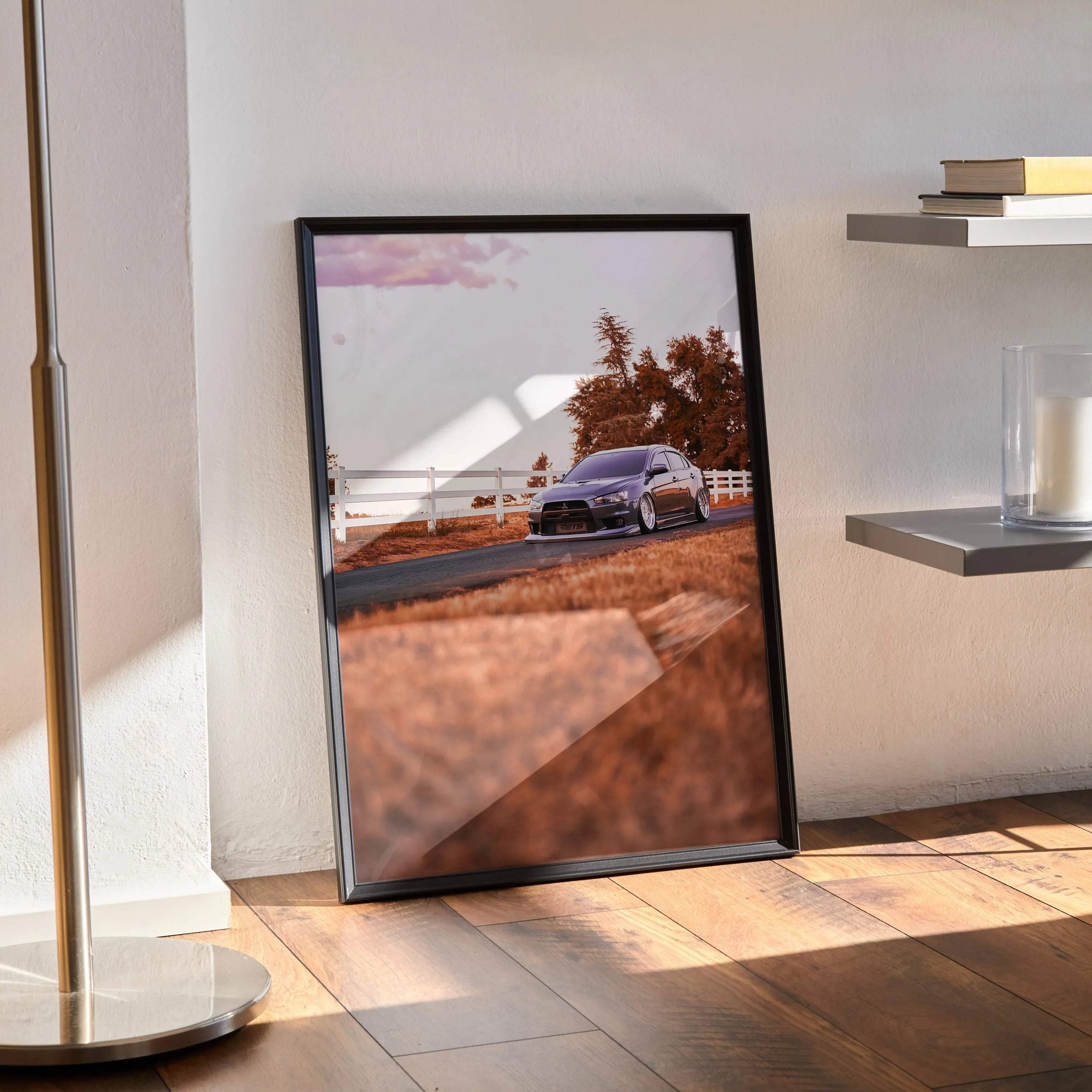 Mitsubishi Evo 10 poster with high-resolution car image in black frame leaning on floor wall art.