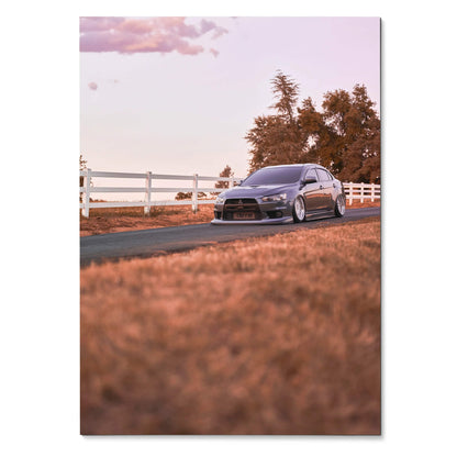 Mitsubishi Evo 10 parked on country road at sunset poster wall art.