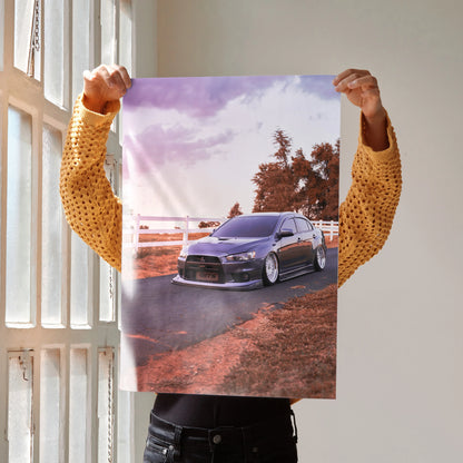 Mitsubishi Evo 10 car poster with scenic sunset background, vibrant wall art for car enthusiasts.