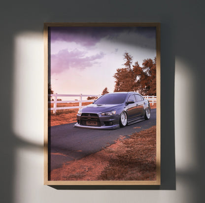 Mitsubishi Evo 10 poster wall art showcasing the car on a road at sunset with warm tones.