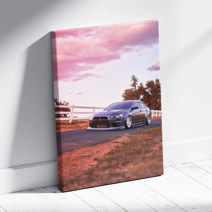 Mitsubishi Evo 10 on road at sunset with pink sky high-resolution canvas wall art.