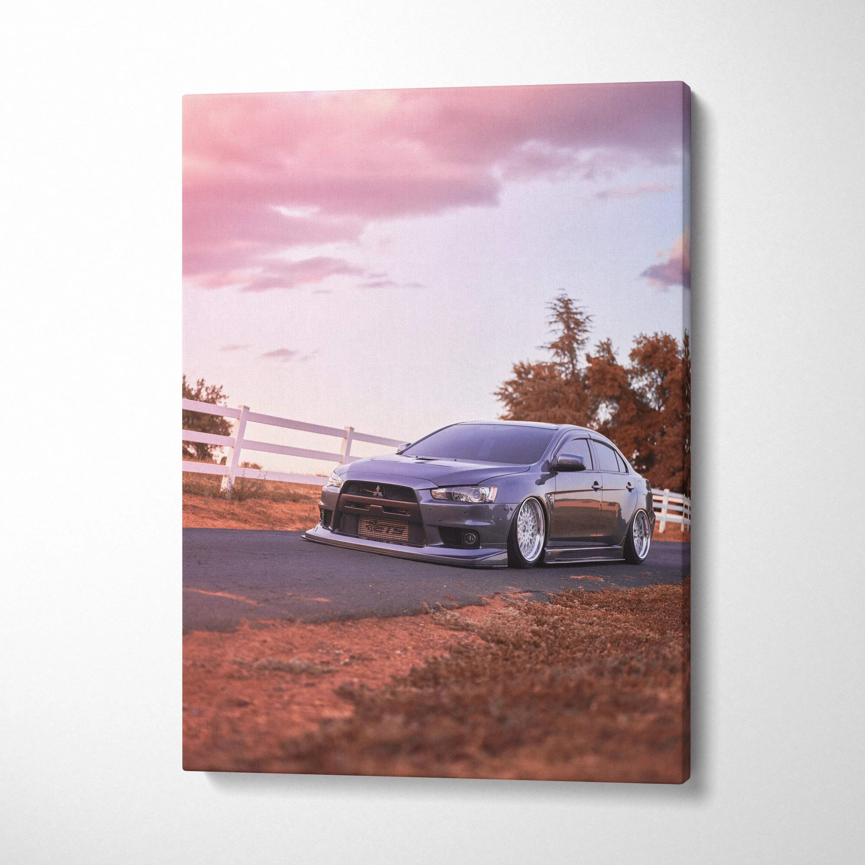 Mitsubishi Evo 10 on road at sunset canvas wall art with warm tones and vertical layout.