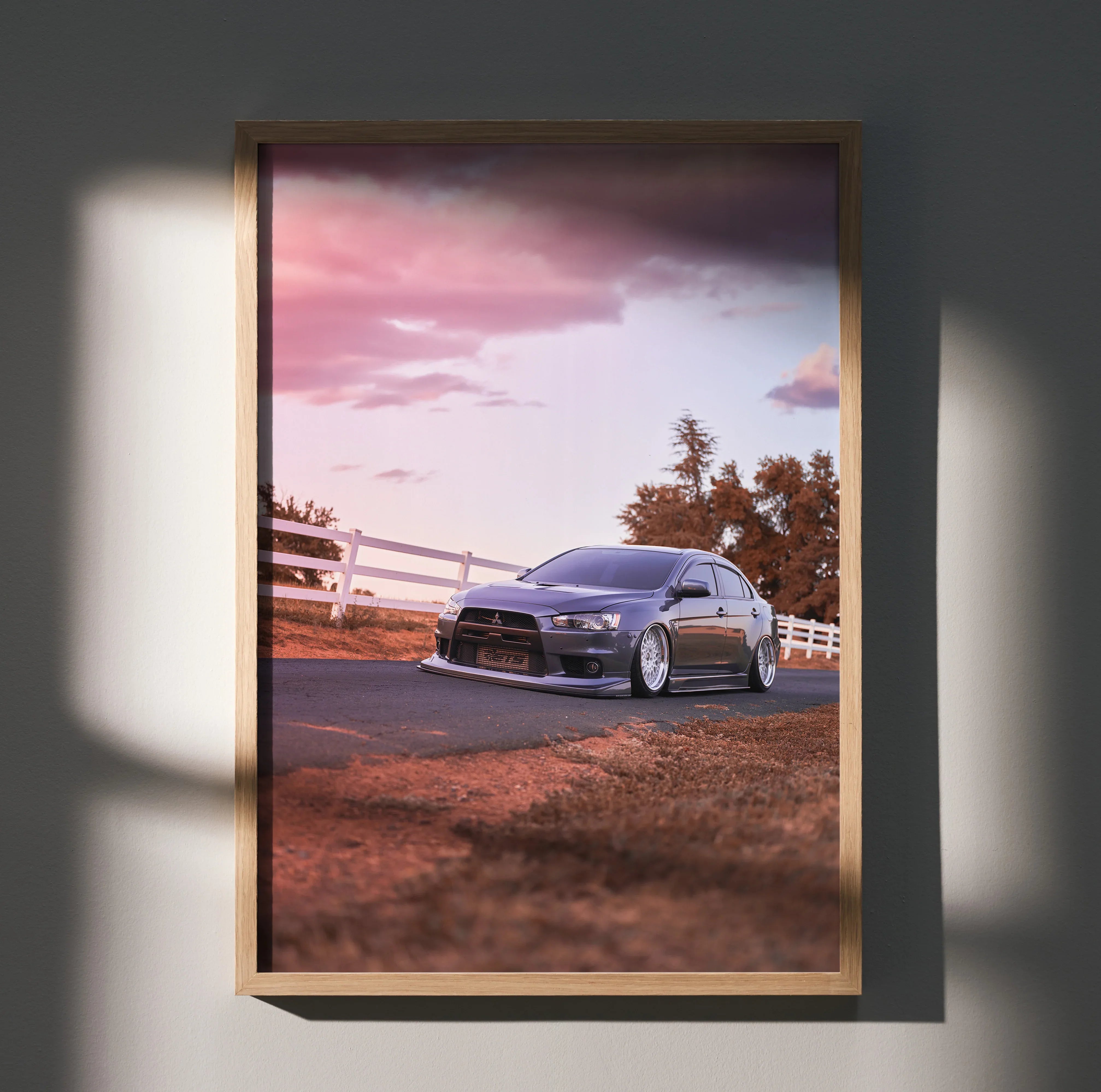 Mitsubishi Evo 10 parked on road during sunset with warm sky tones, poster wall art.